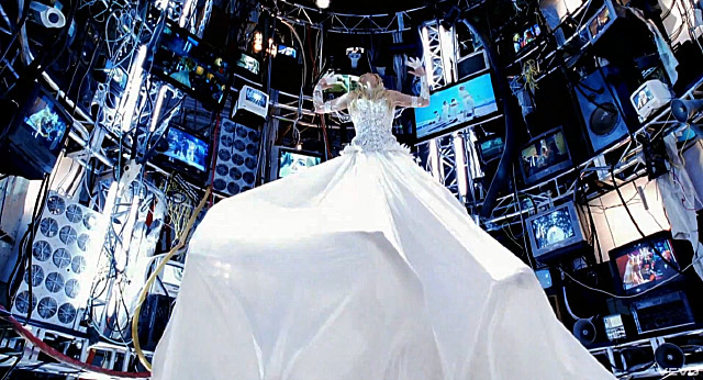 And here's Britney Spears levitating up in her Hold It Against Me music video, also wearing a white wedding gown just like Swift and Siegfrids. Another coincidence? Btw, can you find a baphomet head in the picture (first spotted by VigilantCitizen.org)? It's on the left side of Britney.