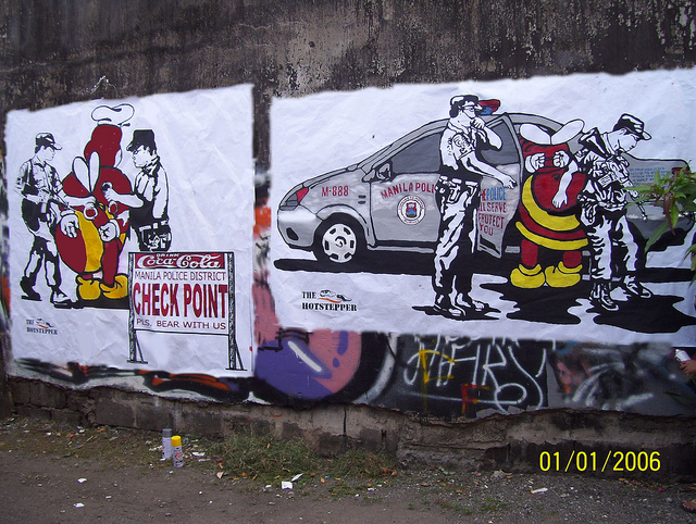 Jollibee arrested by the police. Manila, Philippines. Artist: The Hotstepper. Photo by Strellevik